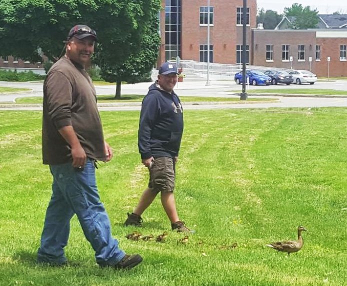 MonroeCC's tweet photo. Nine ducklings and their mom survived a close call on MCC’s Brighton Campus yesterday, thanks to these two guys. Thank you, Paul &amp; Eric! #ThisIsMCC https://t.co/XLbwsGGoUF https://t.co/wutL5XSs3g