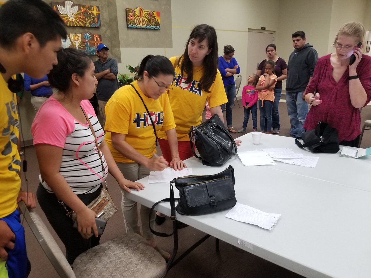 VeroDahlberg's tweet photo. HOLA sorting through the devastation, supporting families, after Ohio immigration raid. Heavily-armed agents with canines and AR-15s seized 114 Ohio farmworkers at a nursery where they plant flowers. CALL OHIO LAWMAKERS NOW! https://t.co/eLMOmjjld1