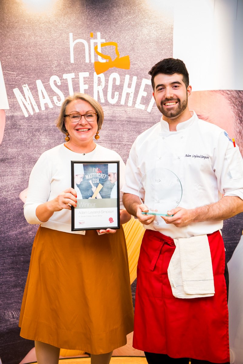 HITTraining's tweet photo. Massive Congratulations to #Apprentice Adam @LeylandSimpson of @BaxterStorey (@StBedesCollege) on winning #HITMasterChef 2018!! 🍾🎉
Here he is receiving his trophy from @HIT_MD1 Jill Whittaker 🏆🏆
His dish of buttered hake with burnt kale and a fennel croquet wowed the judges! https://t.co/uEW3dfCJWt
