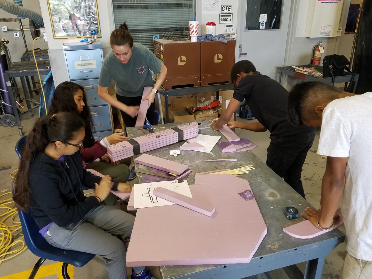 TornadoBots's tweet photo. @atkinstornado students working as a team during the wing shaping phase of #STEMchallenge18 glider competition @LubbockISD https://t.co/MtXWzZpD7W