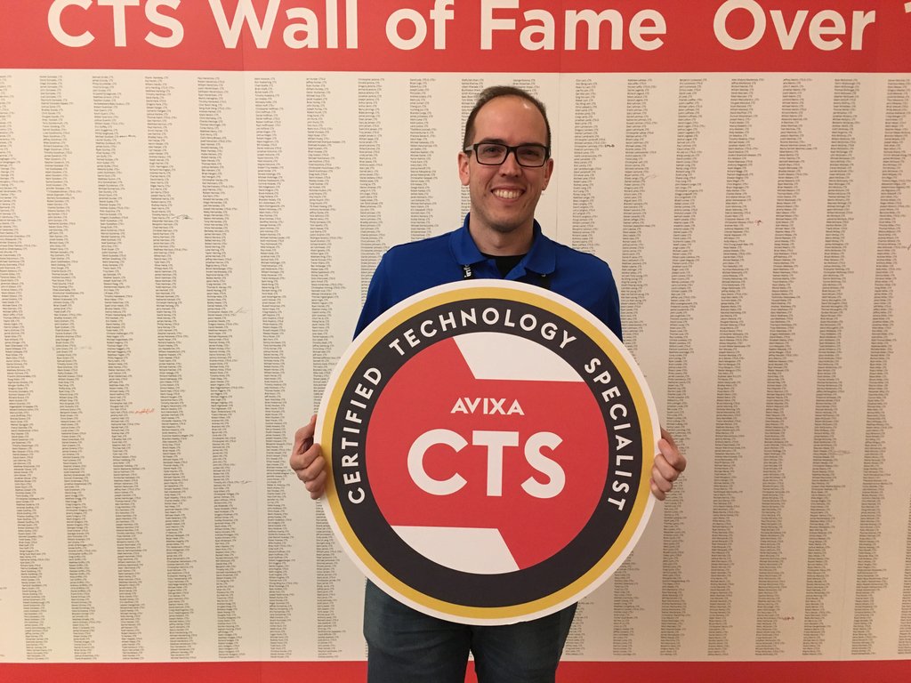 InfoComm's tweet photo. Josh woke up at 3 am on Monday to take his CTS exam — and now he’s celebrating as the first person to earn those three letters at #InfoComm18 #CTSWall https://t.co/L73R1RiYUZ