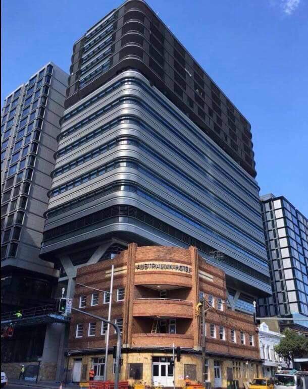 hampton_lodge's tweet photo. Nice that NSW Govt has managed to preserve the heritage listed Australian Hotel. That development doesn’t overshadow the Art Deco Hotel at all! @savesydco @GladysB @abcnews https://t.co/hdQgPwbVWc