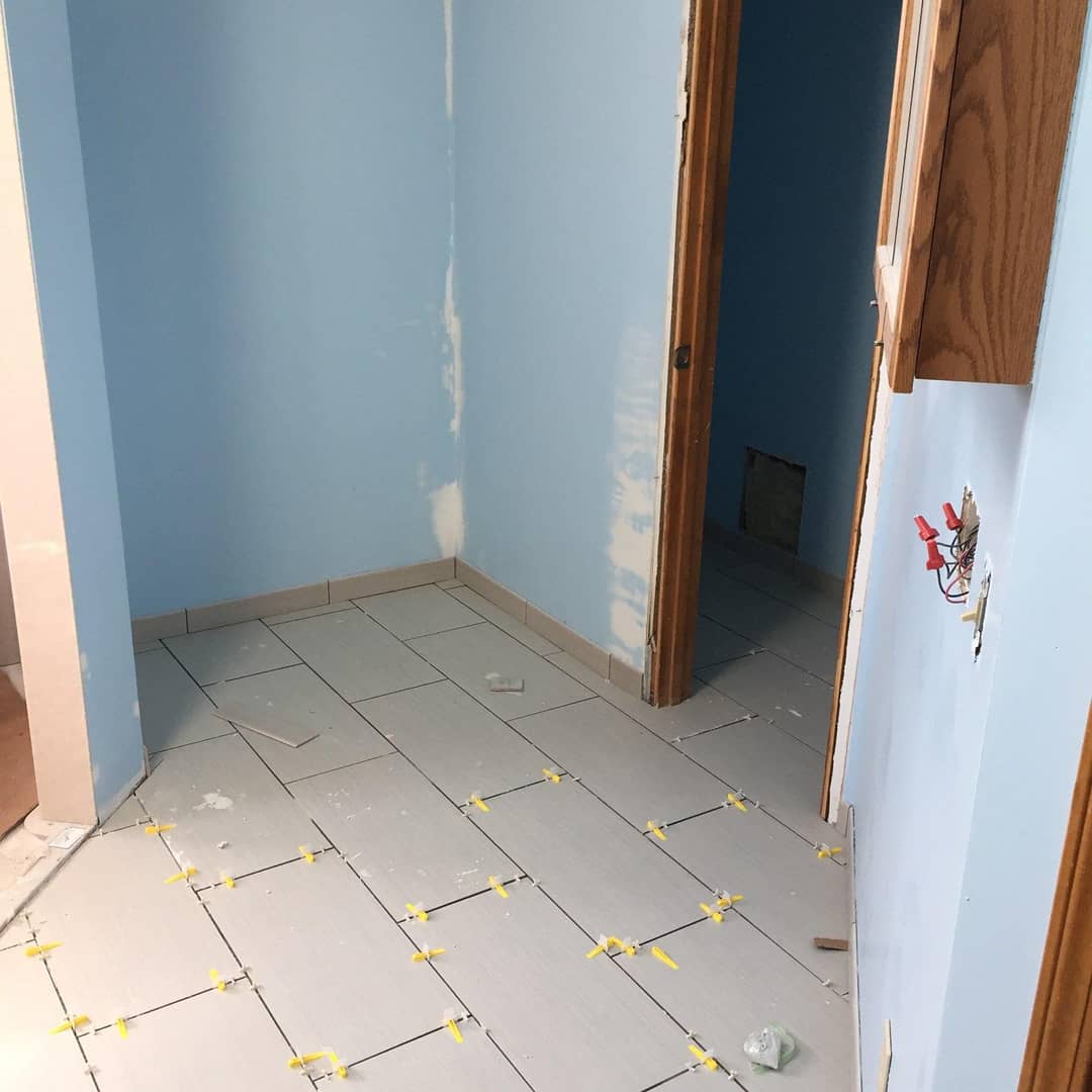 Update on our bathroom remodel.

New vanity and lighting has been installed,
Paint is finished, aside from a few minor touch ups, flooring is almost complete, and the shower has been completely framed and is almost finished.

#lawrenceks #local #contractor #remodel