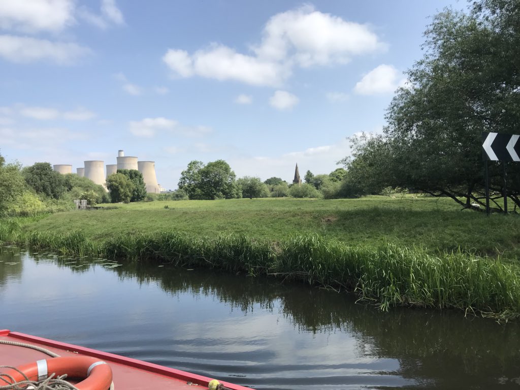 The picturesque Ratcliffe upon Soar power station discreetly tucked behind trees (marred only by a decrepit old church spire) while lazy juggernauts amble by across an elegant road bridge in tasteful concrete.