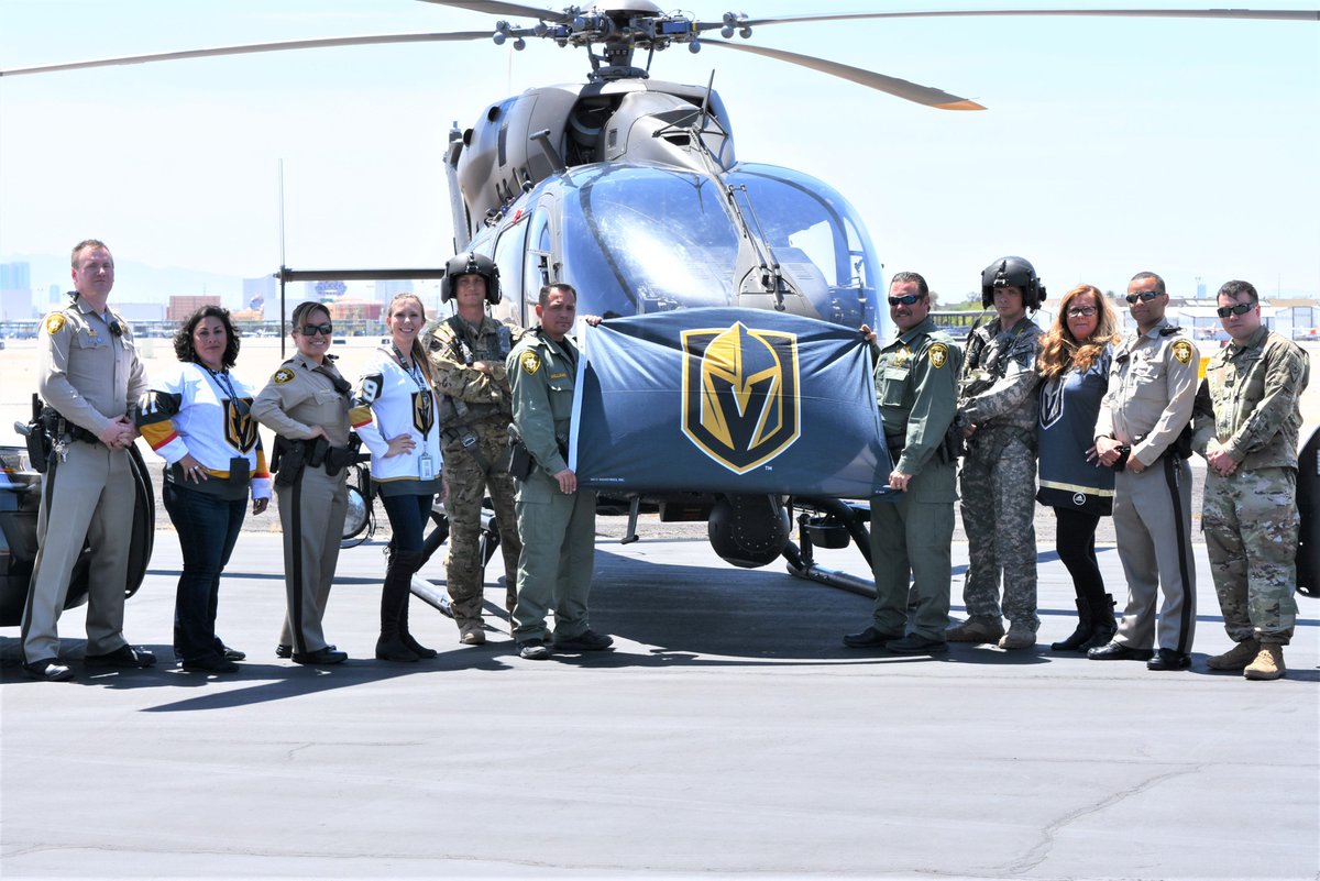 LVMPDBAC's tweet photo. bolden officers &amp; staff join forces with @NVNationalGuard 3/140th aviation unit to cheer on the @GoldenKnights to victory! we are behind you 100%! #3_140thaviation #goknightsgo #vgk #knightup #alldayallknights #goldenknights #vegasborn #vegasstrong #nocaps #boldenpride @ChanceNHL https://t.co/p55kkPPWM2