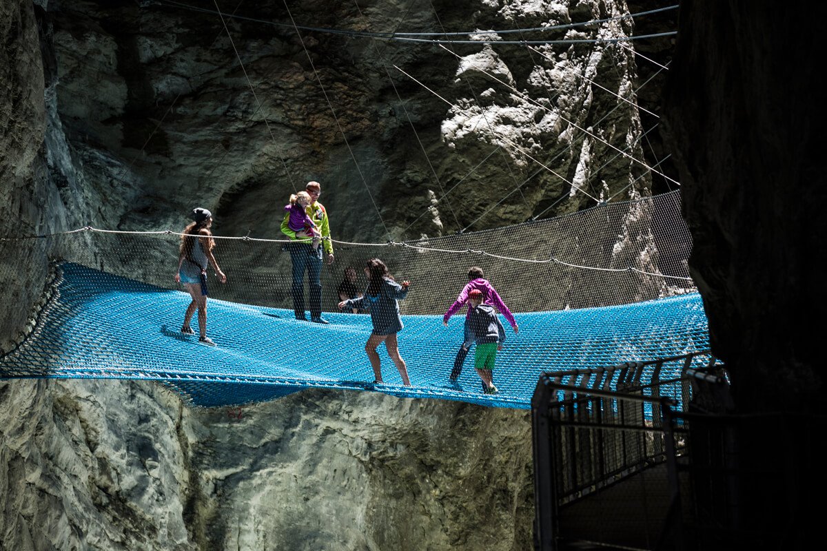 OutdoorInterlak's tweet photo. The Glacier Canyon is a masterpiece of nature! Huge 300m walls carved by ice, featuring a 1km walkway and a giant spiderweb to really immerse yourself in the surroundings. Great activity for everyone in all weather! https://t.co/tJEm3HNEDP https://t.co/kRO4QpnIcz
