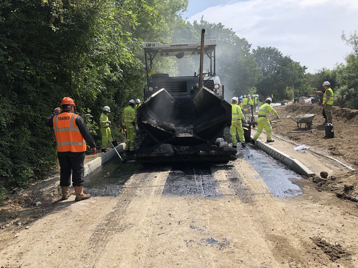 SMI_MPF's tweet photo. Hands on deck laying the binder course with the paver for the MPF Final Project. TQ instructors training and offering advice. Only 6 more days till handover @EngineeringWing @Proud_Sappers @PEW_CI https://t.co/UQMC92GZmH