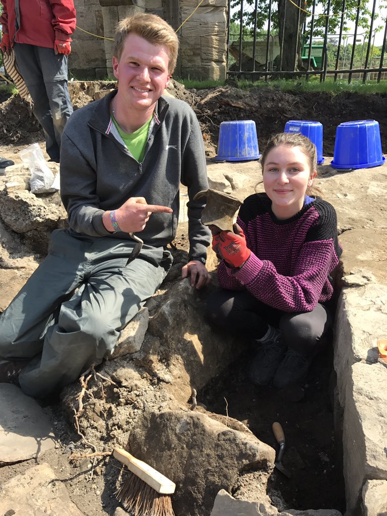 DUACE2025's tweet photo. Adrian and Philippa are looking particularly proud of this amazing bit of pot they've uncovered #DUACE #medievalarchaeology https://t.co/jdn2DmhP77