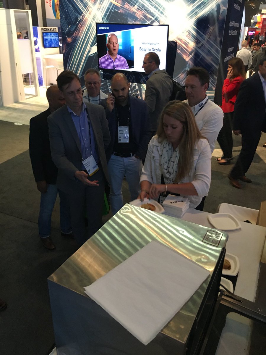 Em_Sollenberger's tweet photo. @aroberts_vertex the Cookie Queen! Handing out the warm chocolate chip cookies at #Booth833 !! Swing by in the next 10 minutes for the last batch! #SAPPHIRE2018 #SapphireNow https://t.co/7ru3Rs8fXh