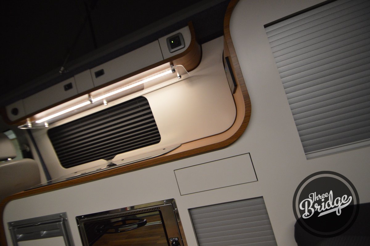 Trek_RV's tweet photo. This Infinity 2 has class and style. Just completed and out the door is this stunning conversion with grill, Webasto heater, Reimo 3000 bed, digital power managemnet and our standard fit under chassis water and gas tanks. #threebridge #campervan #camper #vw #transporter #vwt6 https://t.co/mtOtxlhD8L