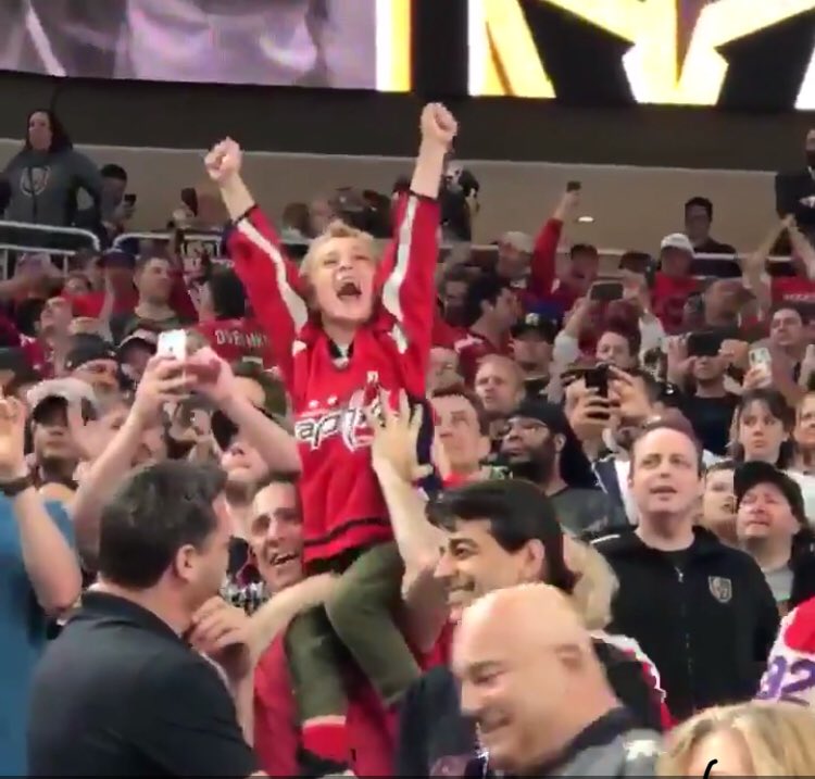 KFCBarstool's tweet photo. The lasting images from the Caps first Cup are so perfect. On one hand we have this father and son sharing a perfect moment of sports bliss and family joy. On the other hand we have a hooker smushing her tits up against the glass. Vegas, baby. Vegas. https://t.co/2lRLkkpzjq