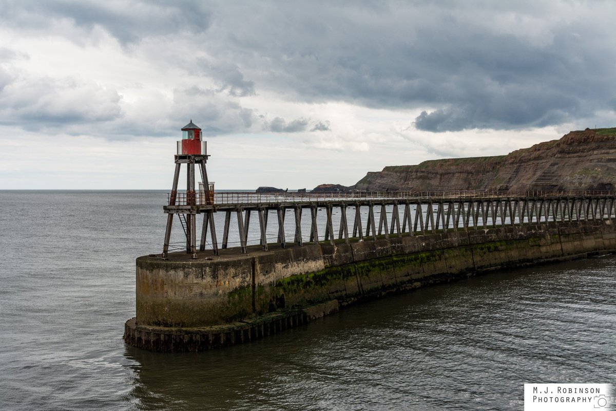 The eastern pier and lighthouse at #whitby harbour in #yorkshire Photograpfed from the accessible west pier. #landscape #photography