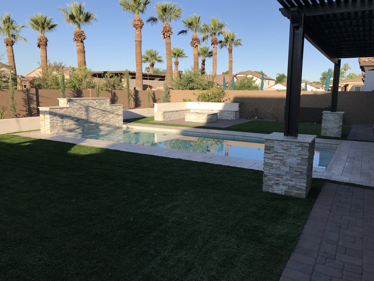 This homeowner used SYNLawn Arizona's Carolina 90 and T Cool infill to create a natural and significantly cooler (temperature) backyard landscape.