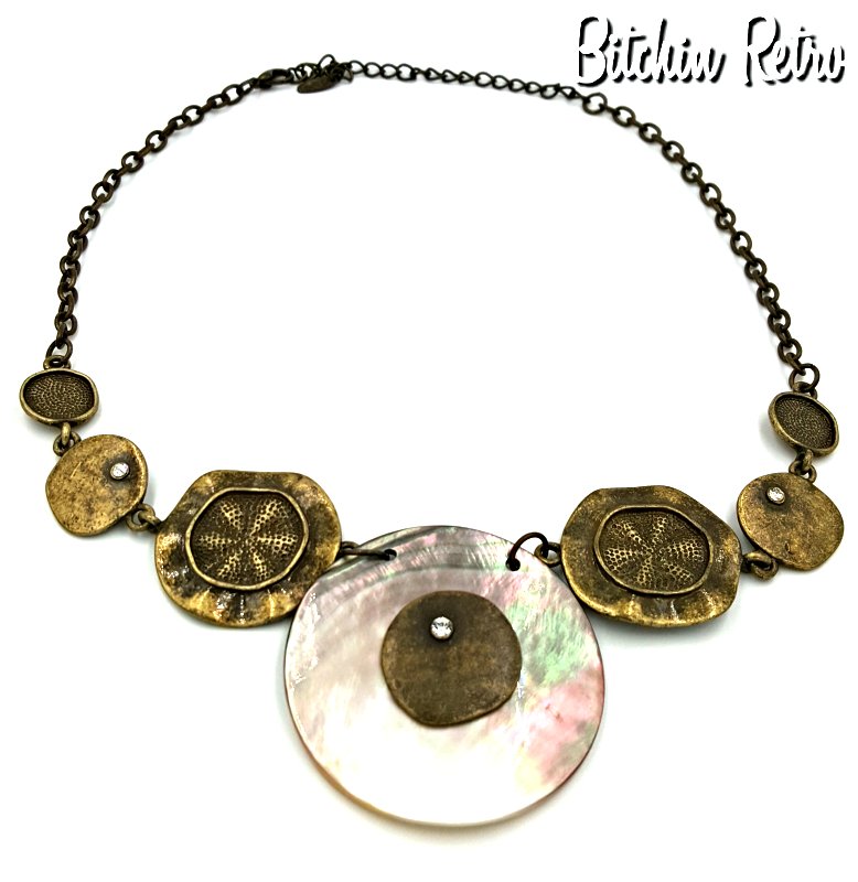 RetroCEO's tweet photo. https://t.co/9l78IdjF4P VCLM necklace with cute, fun & upscale #beachy #style. Center faux shell with that silvery/pinky mother of pearl iridescence reflects light & the subtle #rhinestone accents finish it off. #VCLM #jewelry was sold at high end retailers back in the day. #Cute https://t.co/oDy4fagfaT