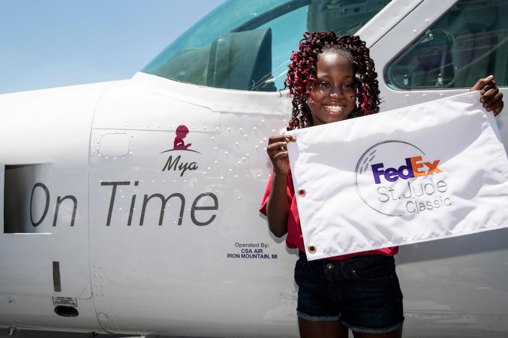 StJude's tweet photo. Each year, @FedEx names a feeder plane in honor of a St. Jude patient at the annual @fesjcmemphis. This year, we loved watching Mya reveal her name on the side of the plane! Learn more about Mya: https://t.co/K7ZwcLjEY0 https://t.co/ilwneVPzEF
