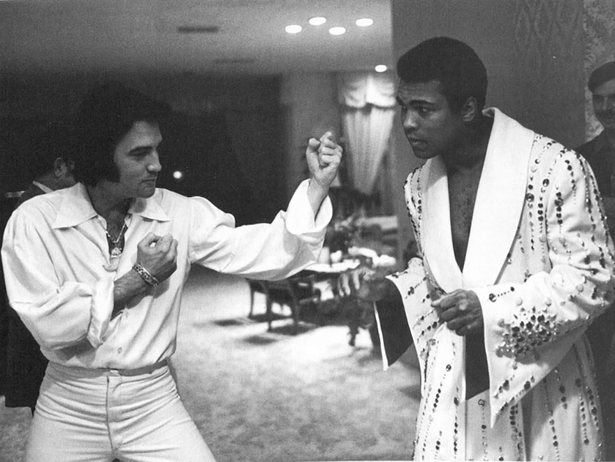 Elvis Presley & Muhammad  Ali, 1973. Elvis has just presented Ali with a robe designed like one of his suits. #elvispresley #theking #muhammadali #cassiusclay #iconicmen #influentialmen #heroes #legends #rarephotos  #throwback #seventies #boxingheroes #musicheroes #sportingheroes