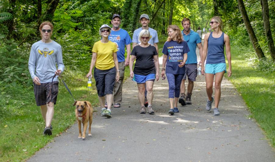 UNCG's tweet photo. Assistant professor Dr. Justin Harmon utilizes the principles of nature-based therapy to help #cancersurvivors transition to a "new normal" after treatment. Read the story to learn how to get involved: https://t.co/6VbvJ5QKFf #therapeuticrecreation #hikingprogram https://t.co/HlVmqiJD1j