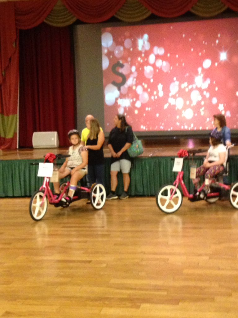 PAIU's tweet photo. What a way to end our #paiu2018 conference raising more than $14k for @VarietyKids &amp; awarding two pink adaptive bikes!! https://t.co/f8Tu93hLuc