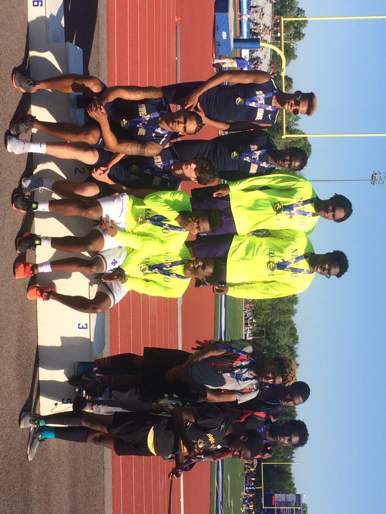 Boys 4x1 on the medal stand after their runner up finish at the state champs.