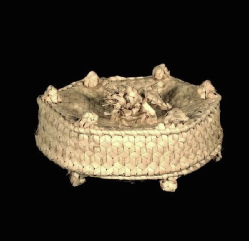 related, these palm leaf baskets from East Timor (artists unknown) that look like cakes. I love them, but —