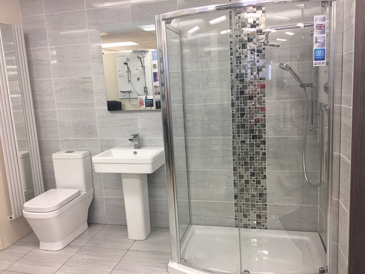This stunning bathroom is displayed in our Wigston Showroom. The tiles are silver stone by designer tiles. Shower enclosure by Kudos #glass4life Shower is Visage by Aqualisa. Sink &amp; Toilet by Smith Briten and a very fancy heated and illuminated mirror by HIB.