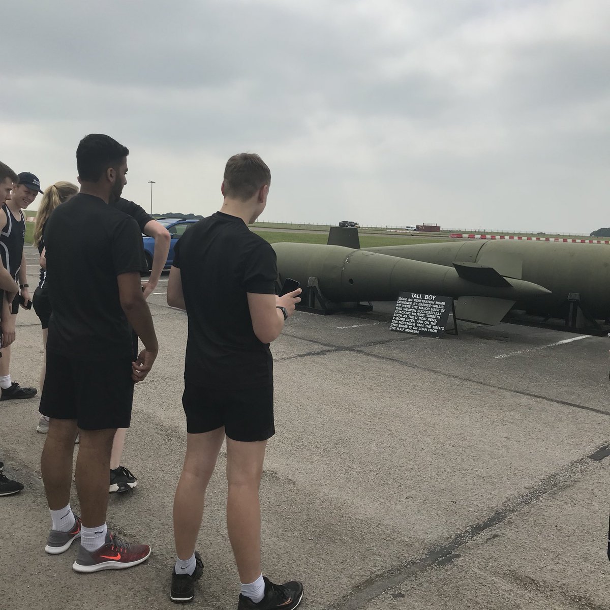 RAFBatonRelay's tweet photo. A few achey legs and some tired eyes but the @WelbeckDSFC students have made it to @RafScampton with the #RAF100 Baton! They had the privilege of standing next to a former @rafredarrows @BAESystemsAir Hawk T1 as well as the chance to go in the RAF Scampton Heritage Centre https://t.co/D1LYGmeKCI