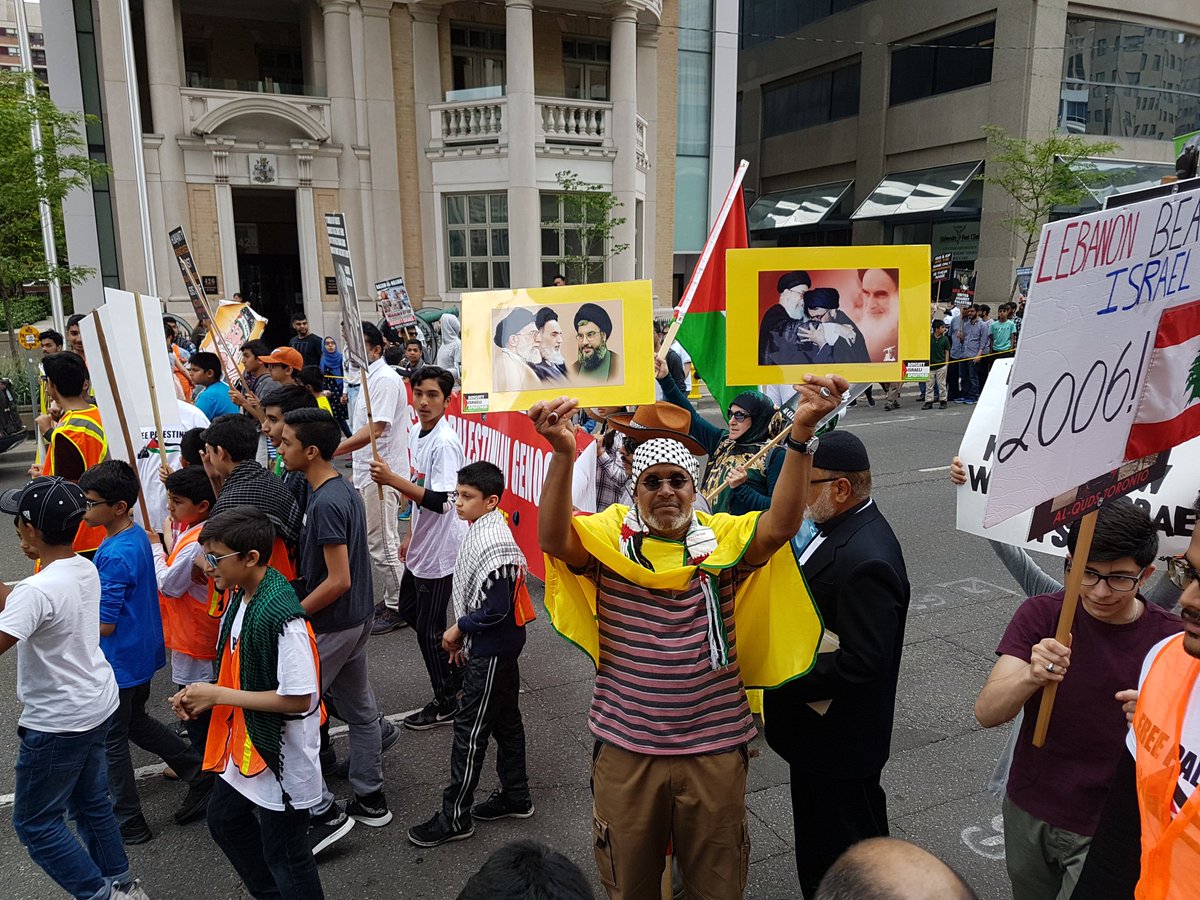 SalmanSima's tweet photo. Al Quds Rally in Toronto. Look at Khamenei, Khomeini, and Nasrollah pictures. Criminals are celebrated in Canada.

#WeStandWithIsrael https://t.co/RId82CqNZG
