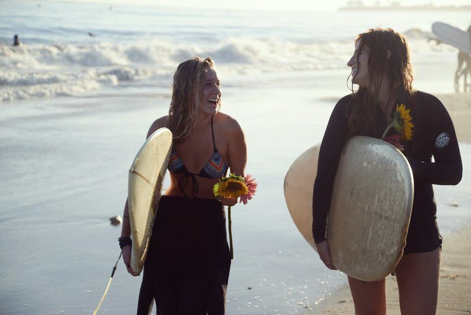 StokeShare's tweet photo. The ladies from @ucsb #surf club taking a stroll after a long sesh. Are those flowers for us? 😍😍😍#stokeshareweekend #surfing https://t.co/OBooujEyV5