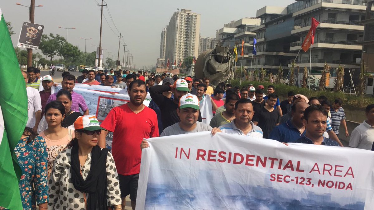 TOINoida's tweet photo. Noida residents organise protest march against waste-to-energy plant in Sector 123 on Sunday morning https://t.co/ACwg3XjugA