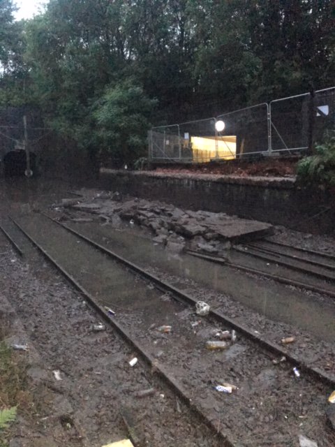 ScotRail's tweet photo. NEW: Heavy rain flooded the railway at #Dalmuir yesterday and the line remains closed. This is because the track has been damaged, a lineside wall has fallen onto the track, and there’s a significant amount of debris to be cleared. ^CT https://t.co/1tUul2Pk97