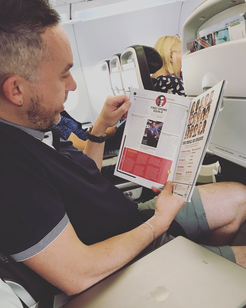 laineypark's tweet photo. Flicking through the in flight magazines and someone finds one of his favourite people! This will make his flight to Athens more enjoyable! #honeymoon #cruise here we come! @Bigbo55man @Lawrence_Jones @UKFast https://t.co/EgceAzpi8H