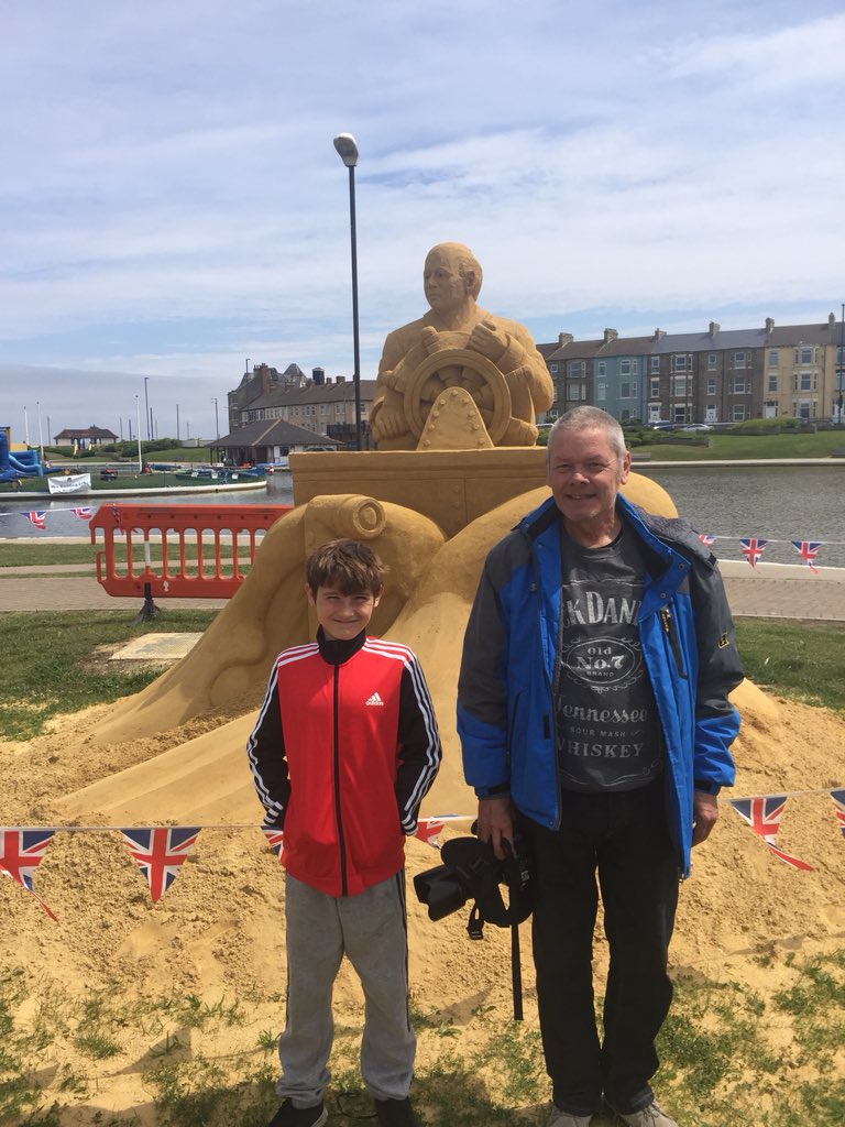 KOTSRedcar's tweet photo. While out screening the sculptures this morning I heard a man say to his grandson, “Come on, let’s go take a picture of your Great Great Great Granddad”.  John Dixon brought his Grandson Vinnie to see his relative Capt. John Bell from Redcar. @RedcarCleveland @SandSculptureUK https://t.co/F86ja1lWEP