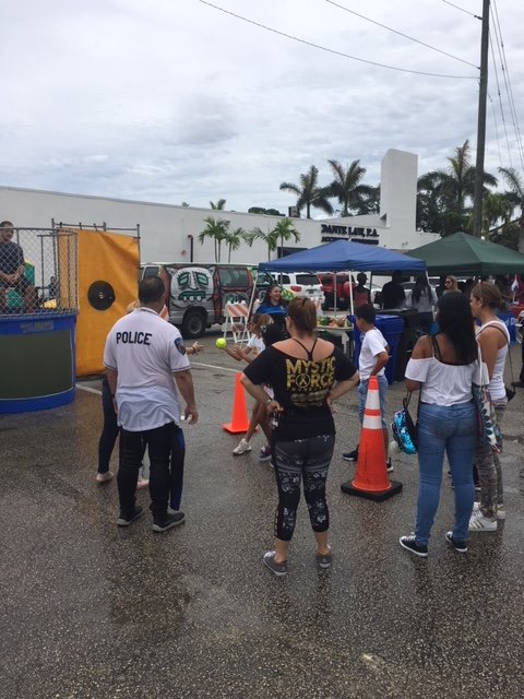 myNMBPolice's tweet photo. HAPPENING NOW: NMBPD is at the North Miami Beach Farmers &amp; Artisanal Market (16400 NE 19 Ave). We are also joining forces with @MysticForceFdnt to combat #ChildhoodCancer. #IamNMB #CityOnTheRISE https://t.co/5LiMilSOrS