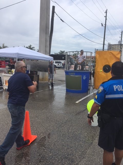 myNMBPolice's tweet photo. HAPPENING NOW: NMBPD is at the North Miami Beach Farmers &amp; Artisanal Market (16400 NE 19 Ave). We are also joining forces with @MysticForceFdnt to combat #ChildhoodCancer. #IamNMB #CityOnTheRISE https://t.co/5LiMilSOrS