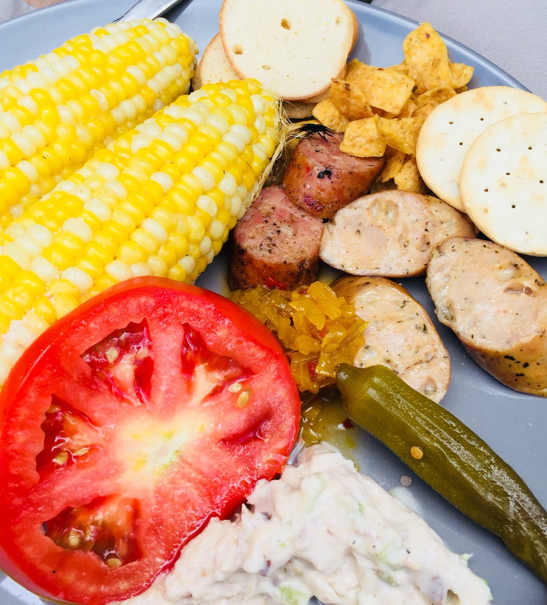 ChefShep17's tweet photo. Charcuterie plate, Plant City style. Smoked and chicken sausages, fish spread, pickled okra, chow chow, and grilled corn. #FrontPorchDining https://t.co/jW06NbBm8x