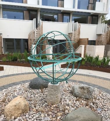 davidharber's tweet photo. Our classic Armillary Sphere looks wonderful in the gardens of the new #GabrielSquare development by @MeyerHomesUK. Featuring a bronze verdigris patina, this traditional sundial is designed to stand the test of time. Read more on this design here: https://t.co/qyYcex2ne7 https://t.co/TmchmcLpY0