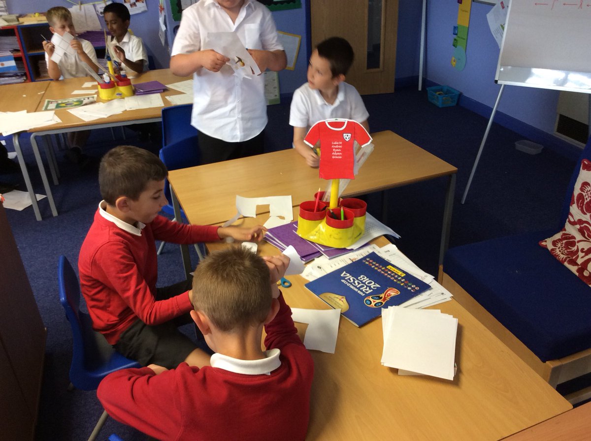 BrookPebble's tweet photo. Year 3 making 3D shapes using nets. Abi is attempting to challenge Mr Bilotta to make a dodecahedron #brave #funmathslesson https://t.co/AVSs0ykZ2A