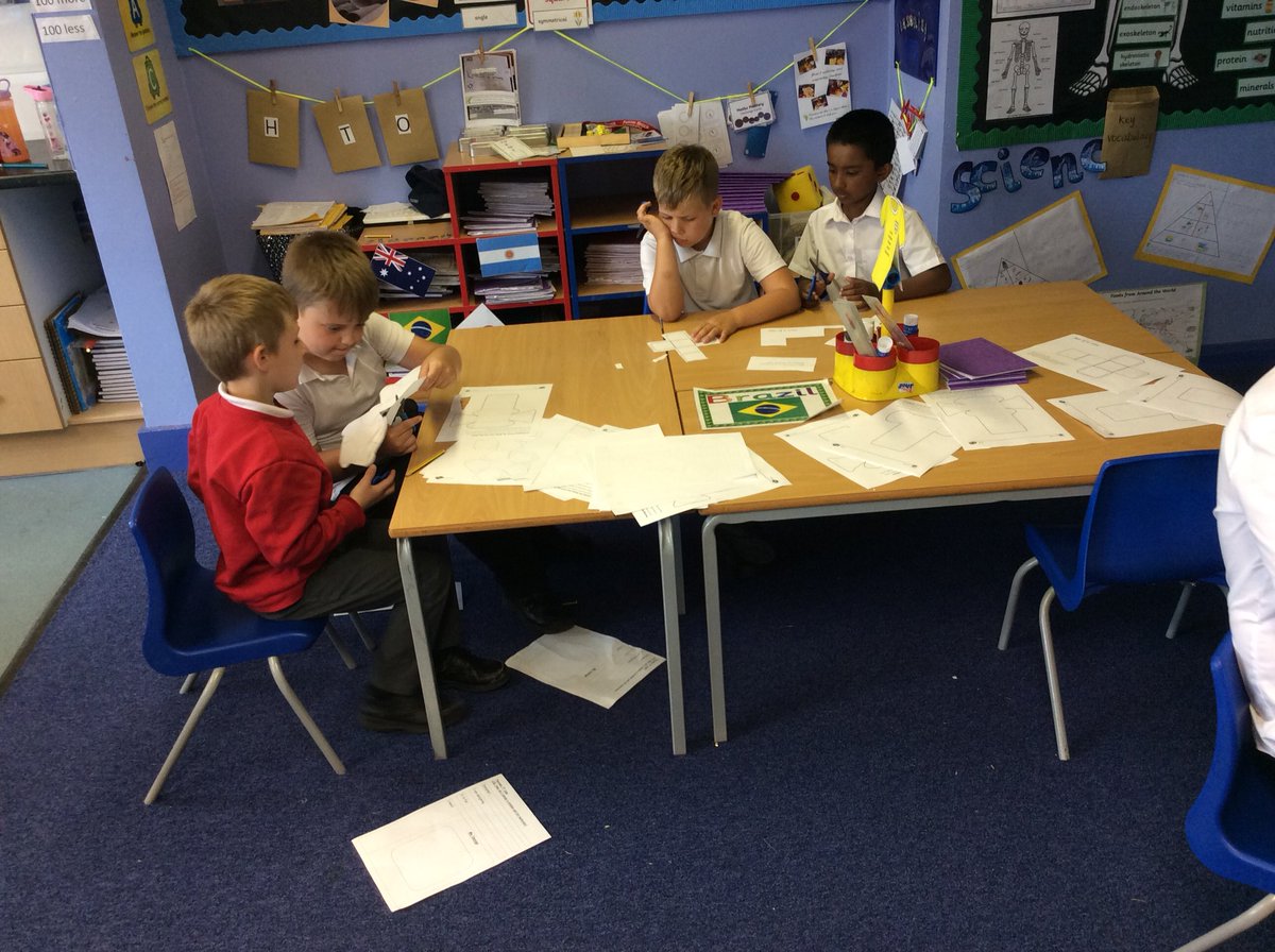 BrookPebble's tweet photo. Year 3 making 3D shapes using nets. Abi is attempting to challenge Mr Bilotta to make a dodecahedron #brave #funmathslesson https://t.co/AVSs0ykZ2A
