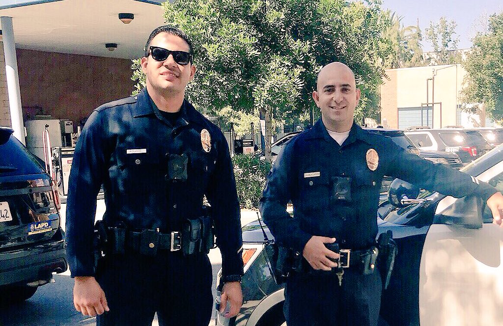 Meet this lifesaving team from LAPD Mission Division. While Officer Baghdasarian fended off 3 vicious pitbulls who had just mauled a man, Officer Aguirre used his <a href="/USMC/">U.S. Marines</a> EMT training to apply tourniquets to both legs. Doctors said their actions saved the man from bleeding to death