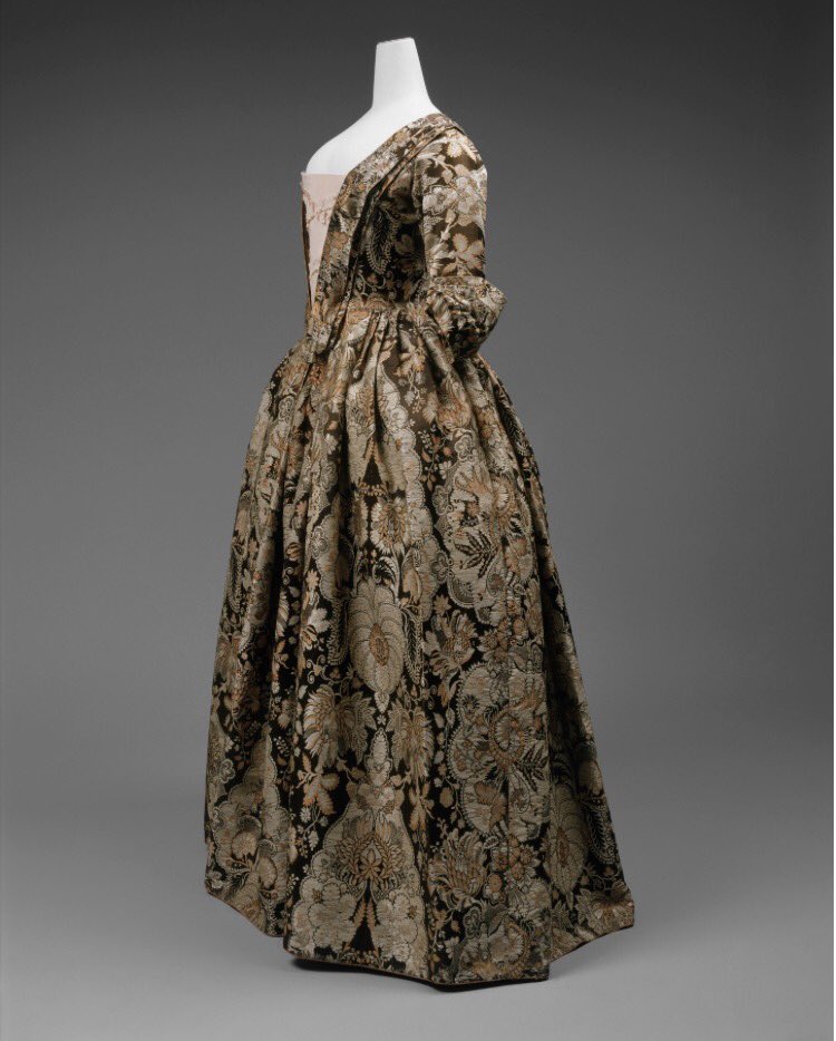 whatgrandmawore's tweet photo. Spitalfields 1725 dress. There are many examples of recycled/restyled dress, however, the @metmuseum states that fashion historian Janet Arnold after examining this garment, could find no traces of alteration. It therefore remains in its 'perfect' state. https://t.co/HurJGgCBwj