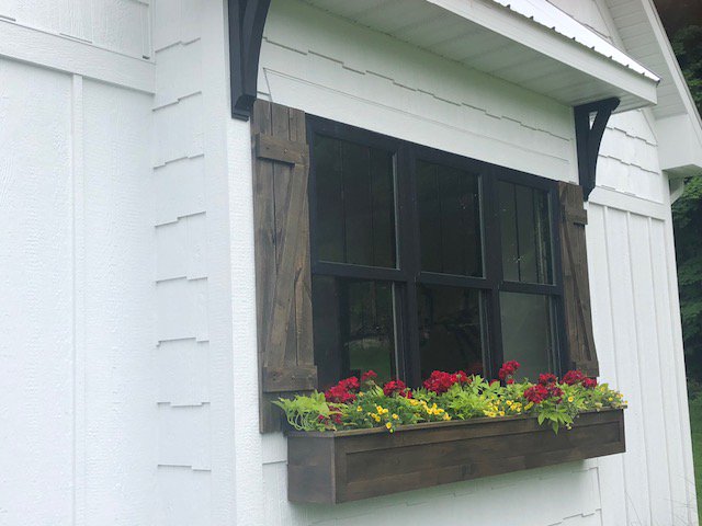 Here is a picture of the custom window box and shudders made by Cabinets Plus. To place your custom order please call us at (269)-948-9774!