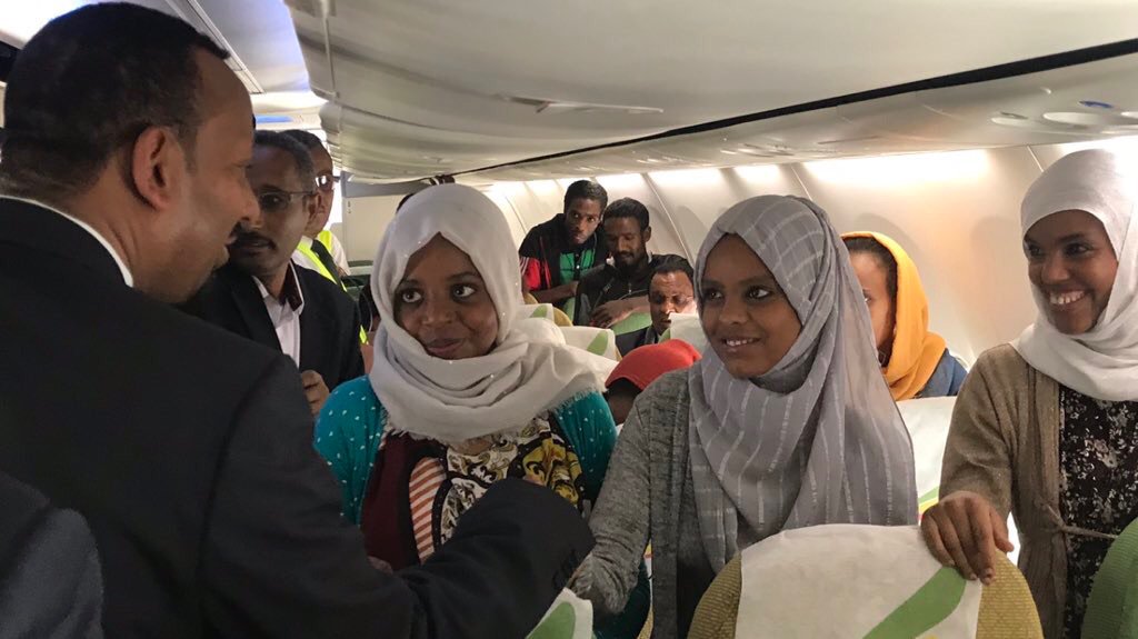 OPride's tweet photo. PM Abiy Ahmed poses for selfies with young #Ethiopia-ns whose release from Egyptian prisons he negotiated. 32 of those freed over the weekend flew home today on Abiy's private plane. Humility. Statesmanship. Genuine concern for the welfare of his compatriots. AAA raising the bar. https://t.co/03VuFQWN0h