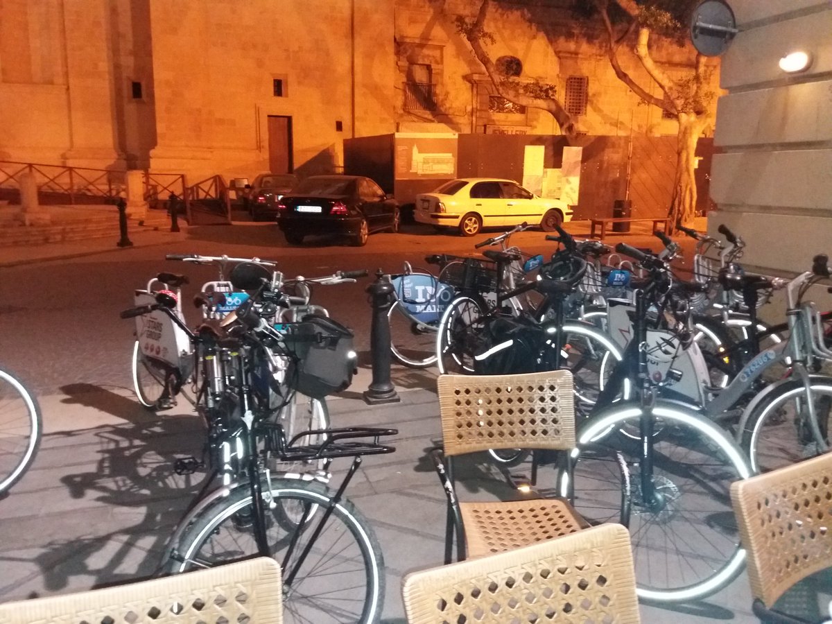TheJimWightman's tweet photo. @MatthewFarrugia @WUR @suzannemaas @BAG_Malta Interestingly the restaurant owner made a big fuss lining the bikes up so they would cause least hindrance. Yet usual casual approach to car parking other side of the street? Speaks volumes about how we accept #carclutter https://t.co/FbJ2cNegvV