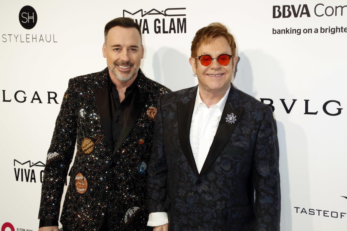 Canada's tweet photo. Elton John and 🇨🇦 filmmaker David Furnish form one of the best known power-couples in the world! A proud Canadian and international activist, Furnish also fights to refocus and re-energize the LGBT fight against AIDS #PrideMonth https://t.co/ozs3XkvpYa