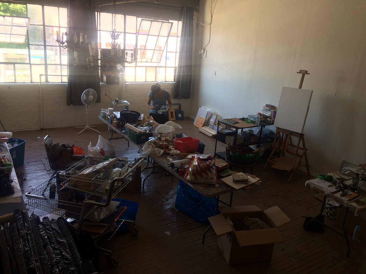Our intern Madge begins the huge process of sorting through  the donated art supplies in order to create gift bags for the artists affected by the fire that destroyed Walnut.