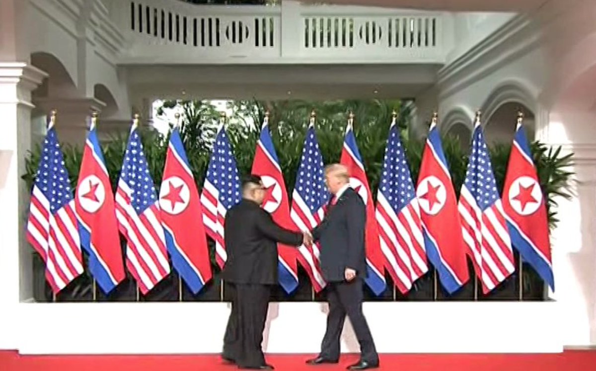 The American flag is hanging side by side with the flag of one of the world's most brutal dictatorships. Kim Jong Un has already gotten what he wants from the #trumpkimsummit.