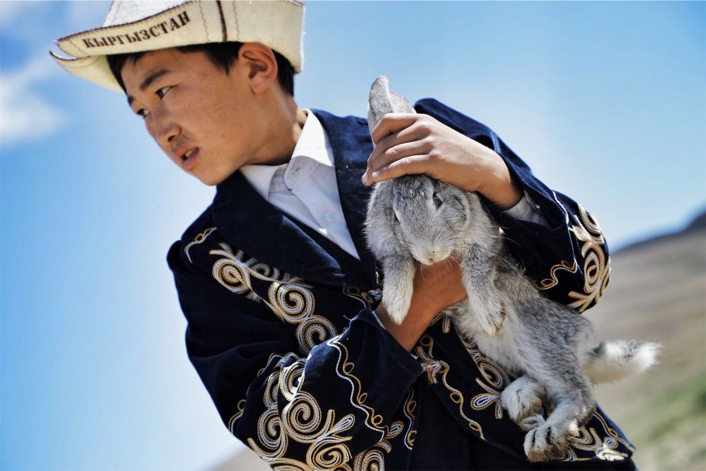 traveltheroad's tweet photo. Boy and rabbit - Kyrgyzstan. | traveltheroad https://t.co/EJj7FgBnID https://t.co/fEcXCiMiah