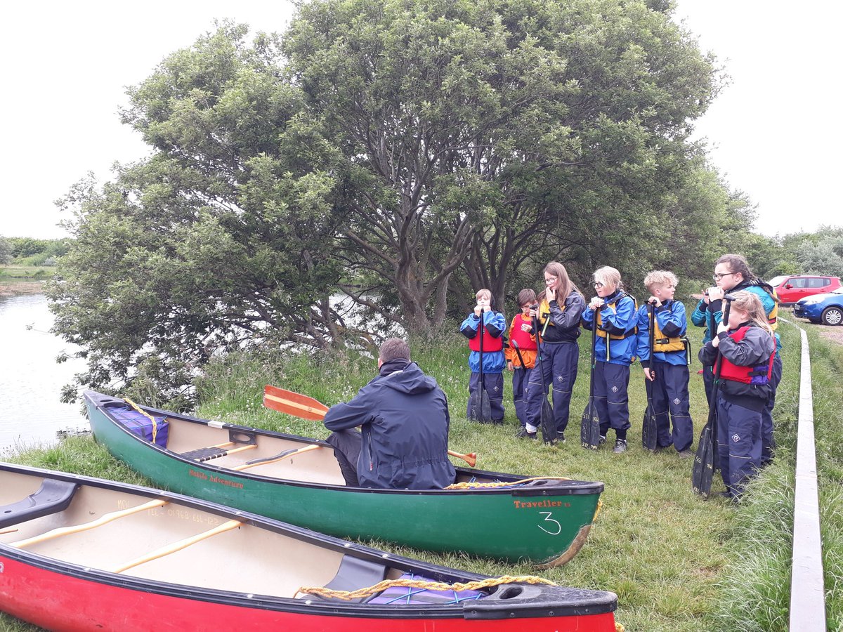 Just about to get into our canoe for the first time. Let's hope it's easier than getting into the life jackets!