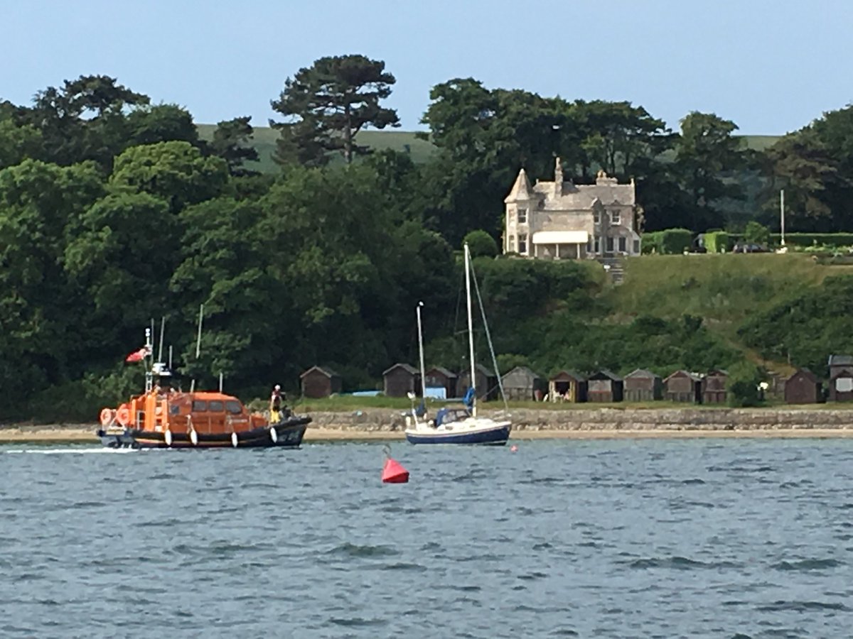 Clairephysio1's tweet photo. @SouthTodayNews Swanage Lifeboat assisting a sinking yacht off Studland this am. Cool calm and efficient as ever. https://t.co/6uPsuKt3Pz