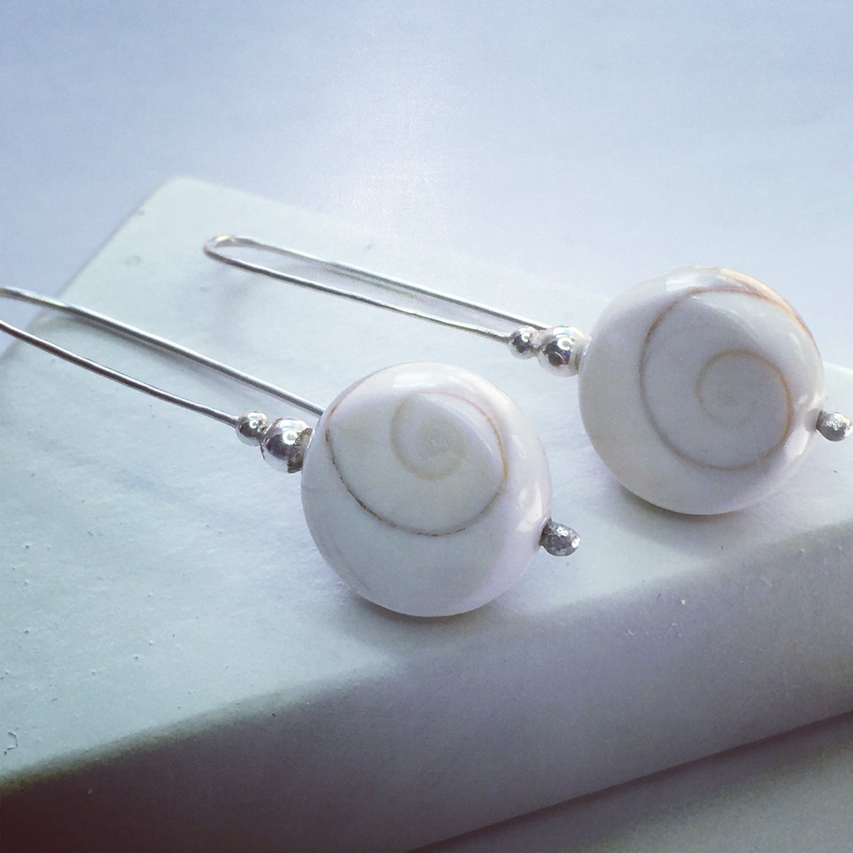 suzidoreydesign's tweet photo. Sneak peak! New Shiva Shell Earrings coming soon to the website & stockists. These have hammered Sterling Silver stems and teeny silver beads, but it’s all about those beautiful spirals 😍 #shivashell #silverjewellery #earrings #hammeredsilver #imadethis #cardiff #suzidoreydesign https://t.co/n9CMyu78uu